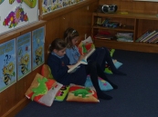The girls having quiet time in the library corner.
